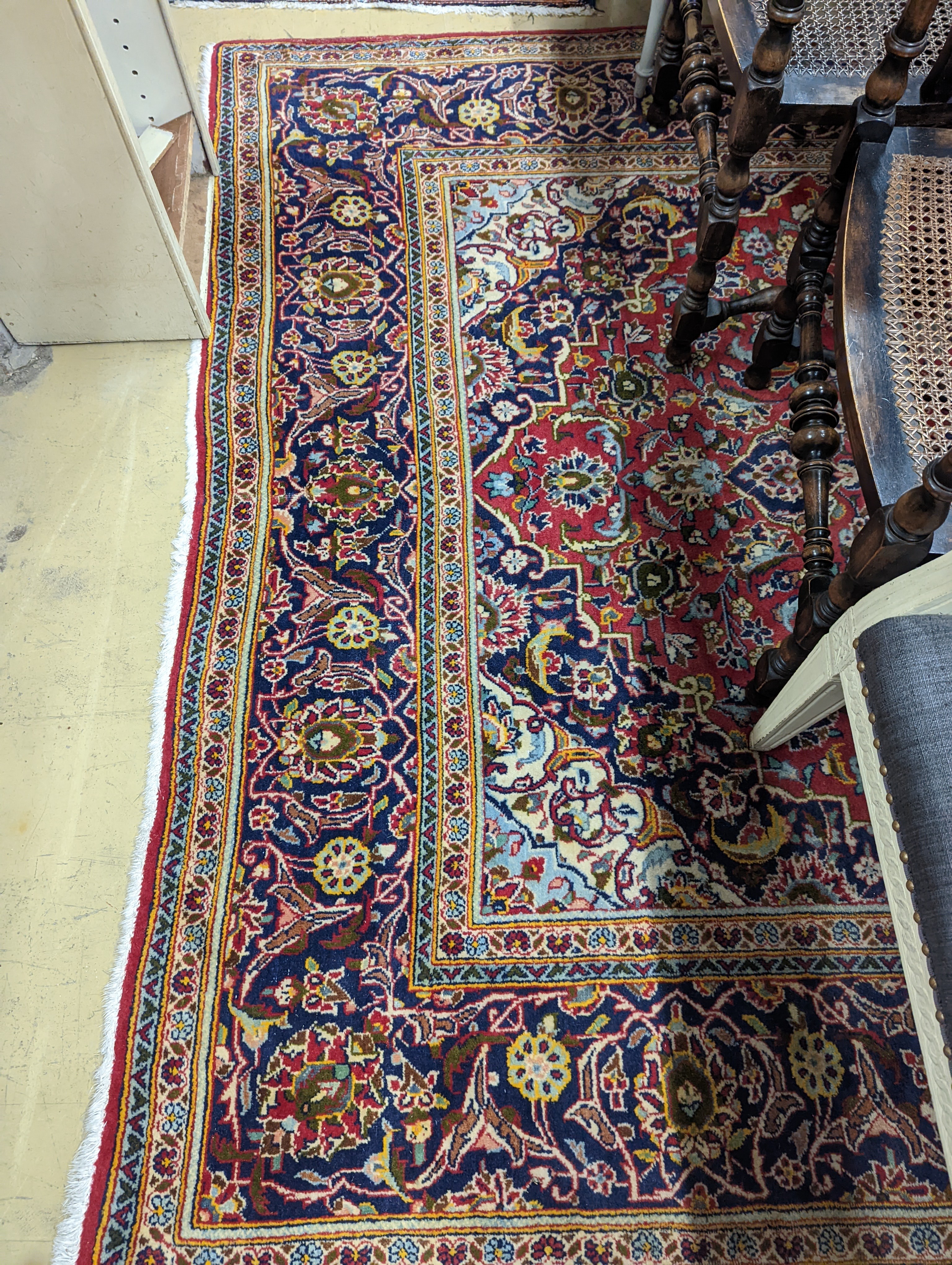 A Heriz red ground carpet, 320 x 204cm
